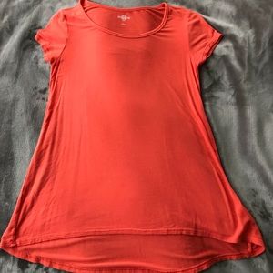 Salmon pink tee. It’s a small but fits medium
